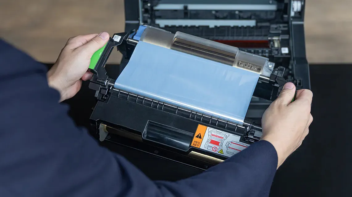 Person changes foil roll on HAK-100 at Brother Gulf, Middle East & Africa